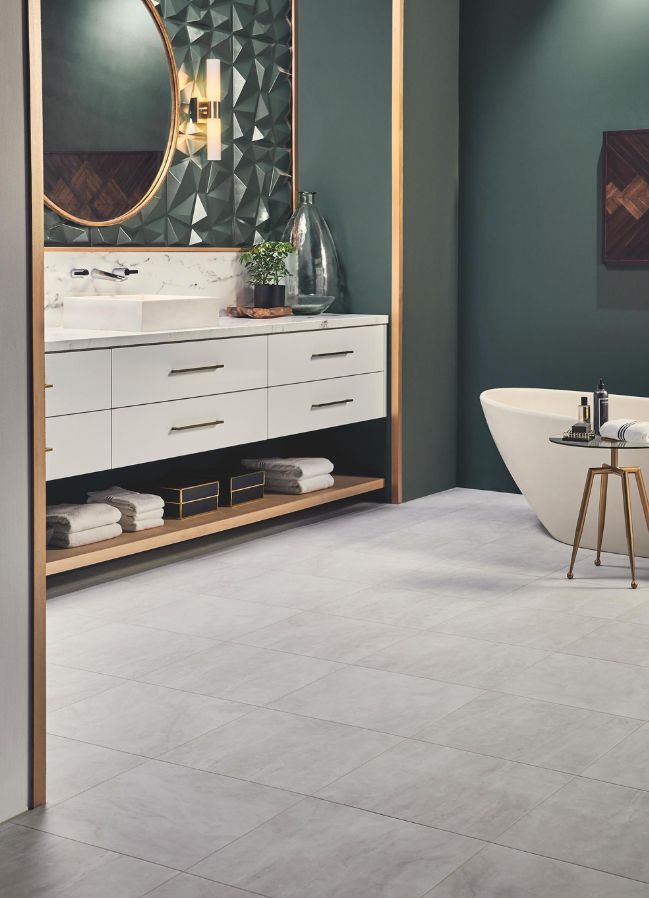 luxury vinyl tile flooring in a modern bathroom with green accent wall