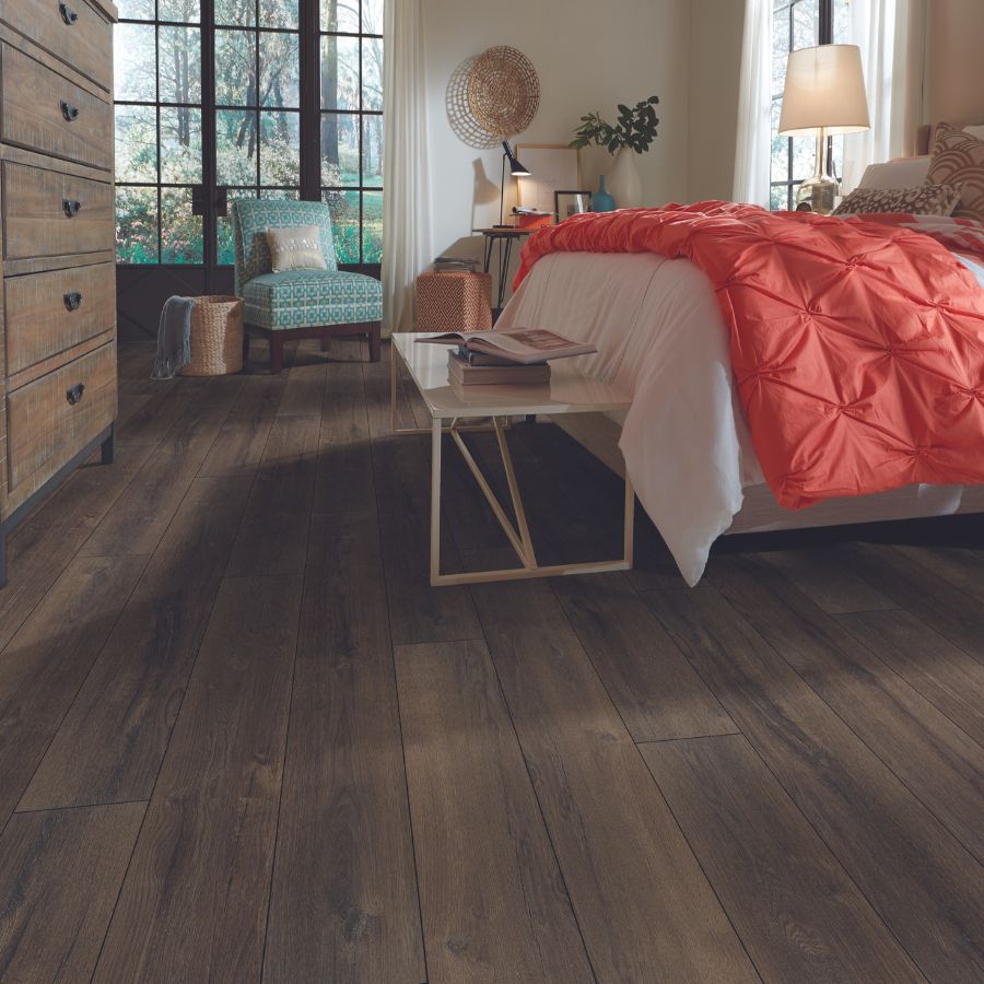 dark stained lvp flooring in a bedroom